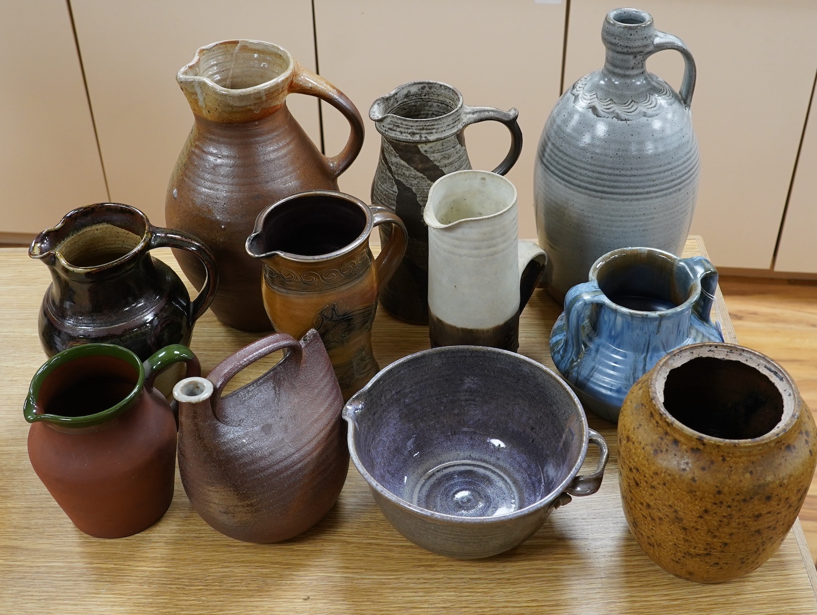 Nine studio pottery jugs, a vase and a bowl, etc. (11)